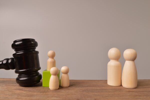 How Long Does a Personal Injury Lawsuit Take? Factors That Impact Your Case. Image of a gavel close to game pieces.