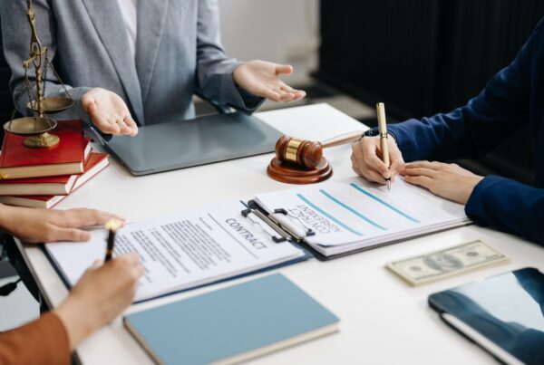 Why Legal Funding Isn’t Just for Personal Injury Cases. Image of a contract signing.